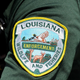 The Louisiana Department of Wildlife and Fisheries badge on an officer's uniform